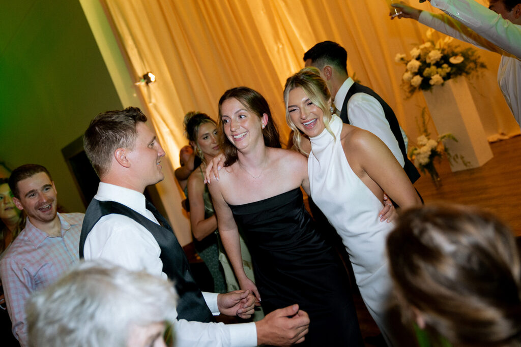 bride and groom with their guests at their editorial wedding reception party