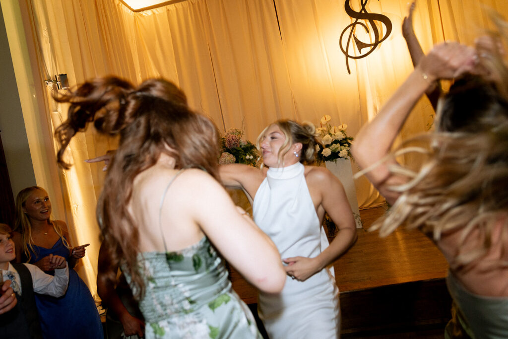 happy bride dancing at the reception