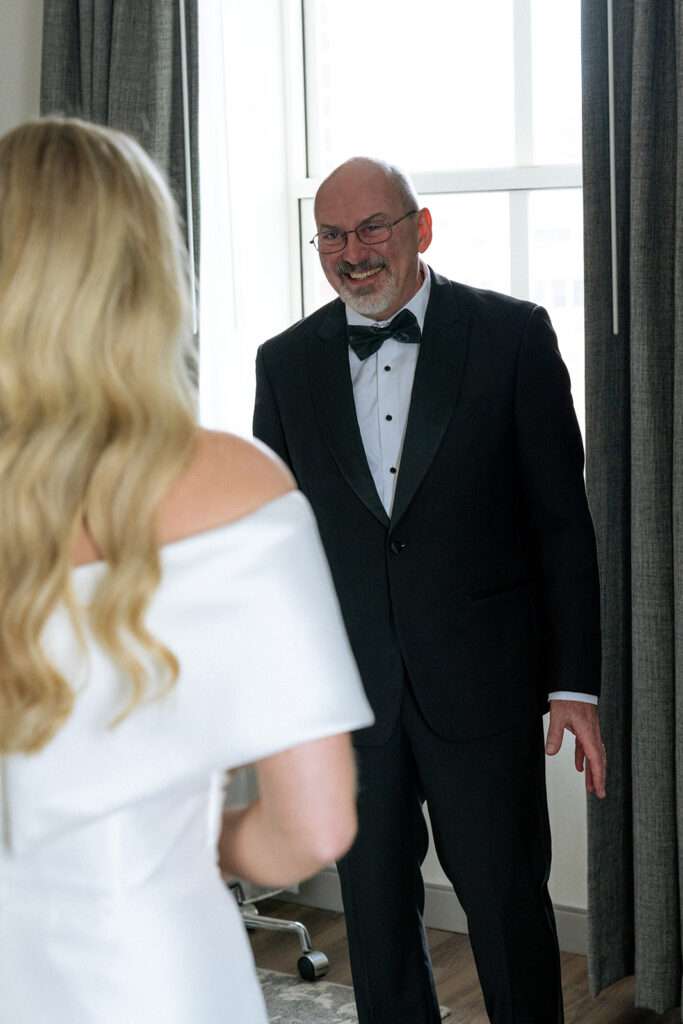 father of the bride emotional seeing her in the wedding dress