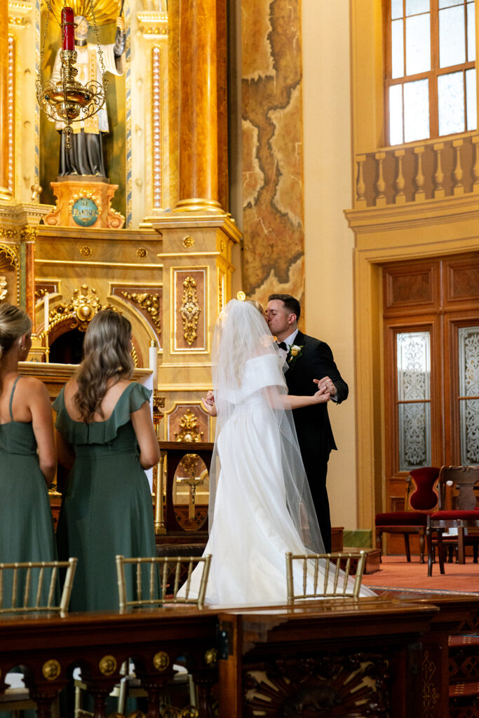 couple kissing after their ceremony