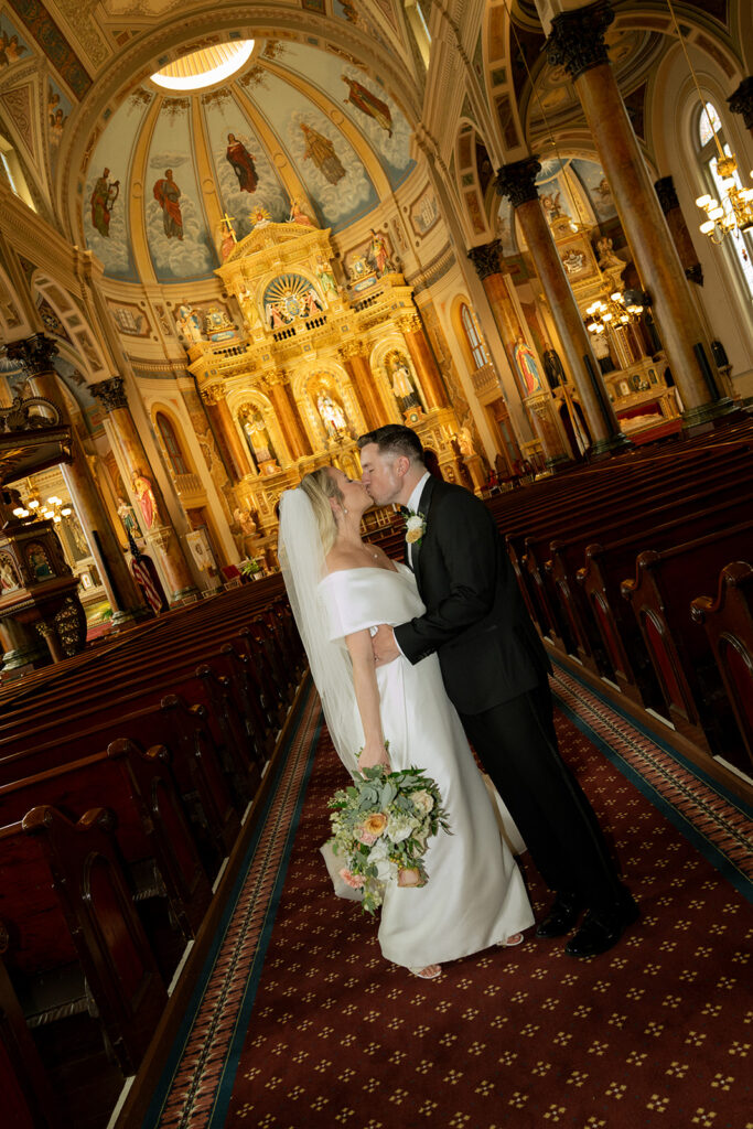 portrait of the newlyweds kissing