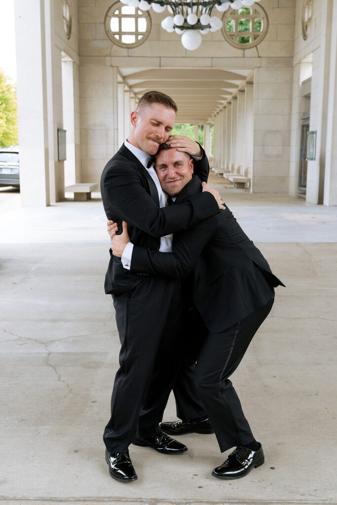 playful picture of the groom and a groomsmen 