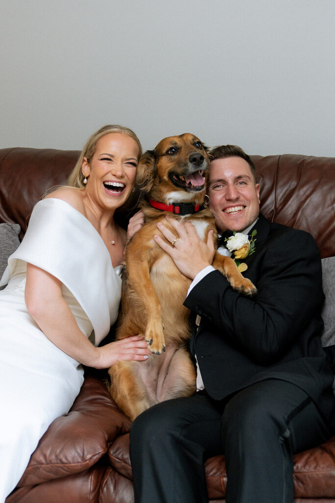 adorable picture of the newlyweds and their dog 