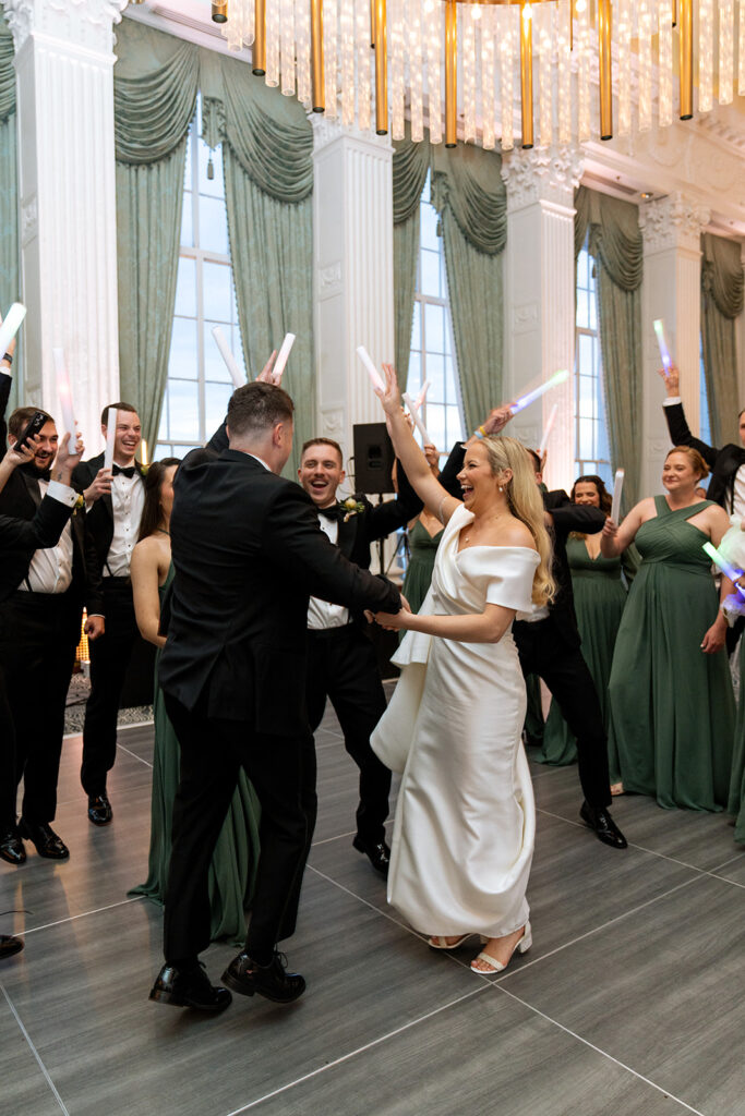 bride and groom entering their reception