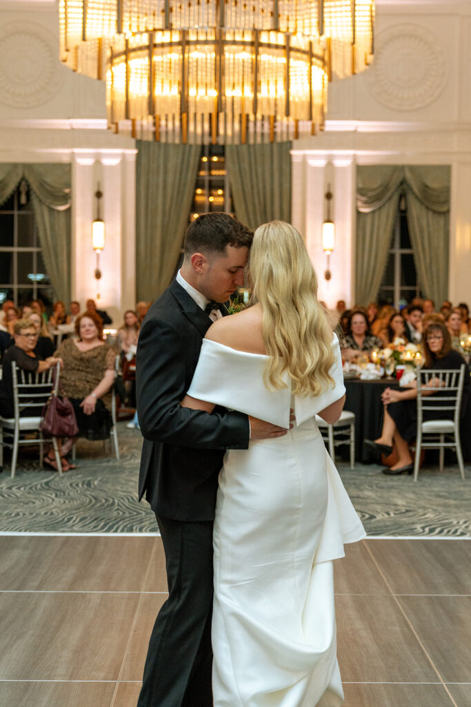 happy newlyweds dancing at their reception