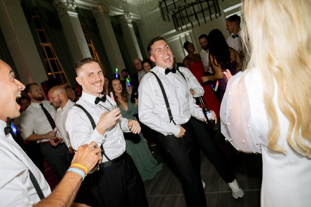 wedding guests and groom dancing at the wedding party