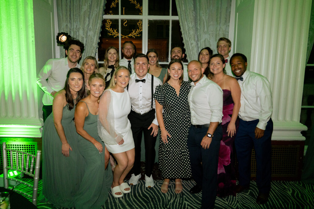 picture of the newlyweds and their guests at the reception party