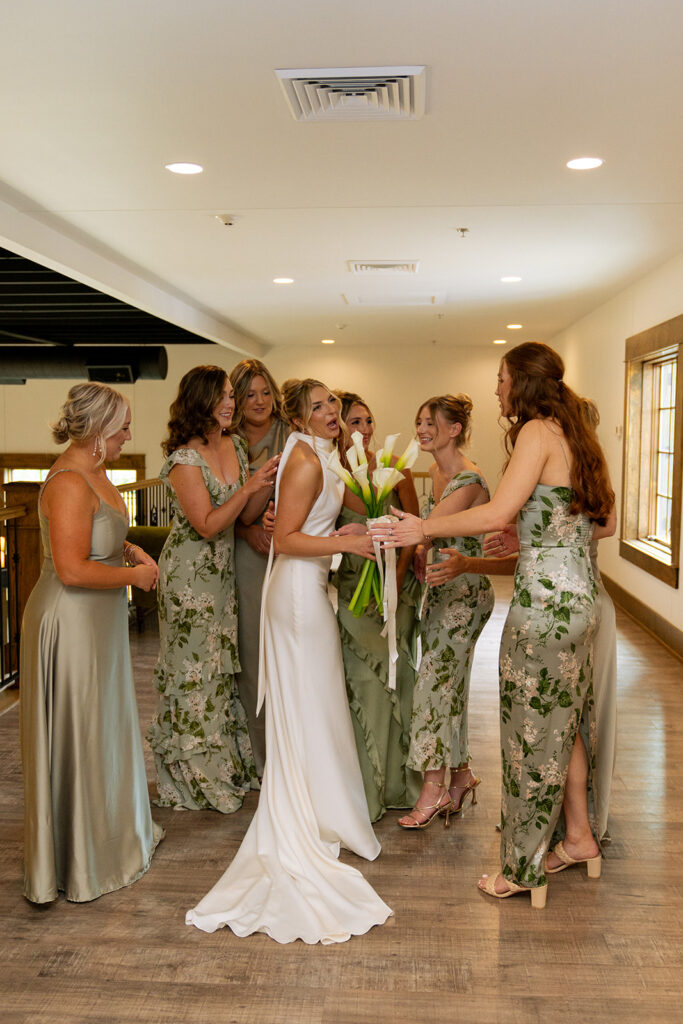 bride and her bridesmaids hugging