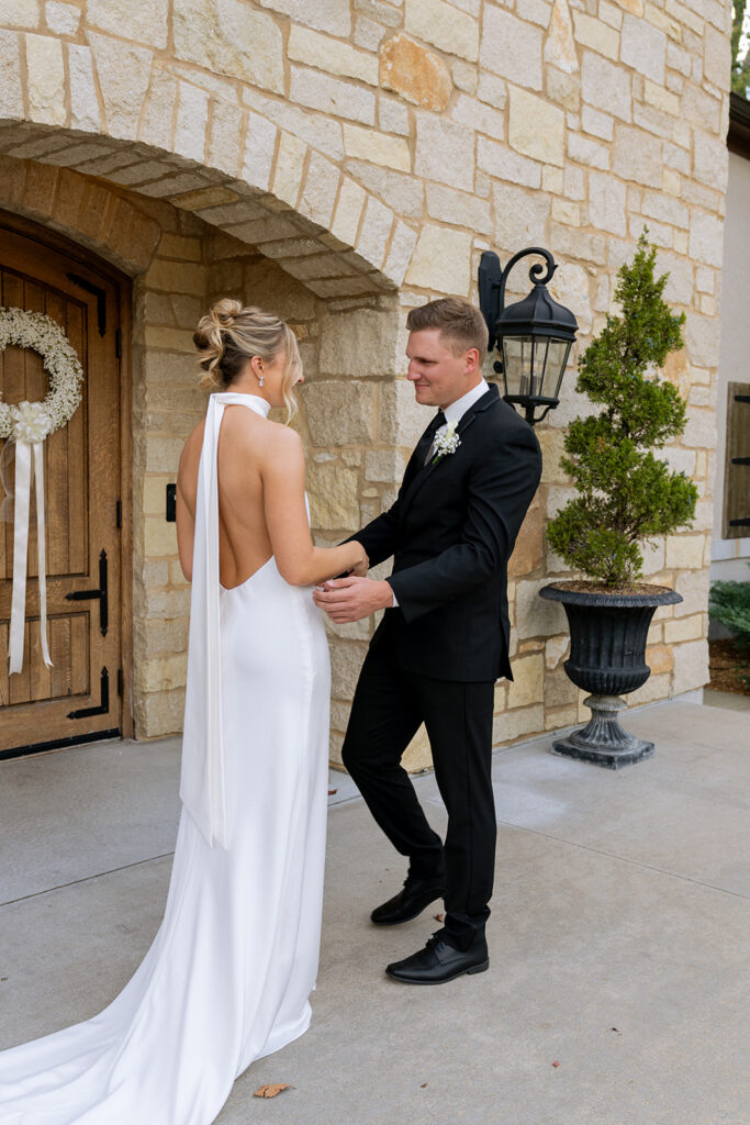 groom emotional seeing the bride for the first time in her wedding dress