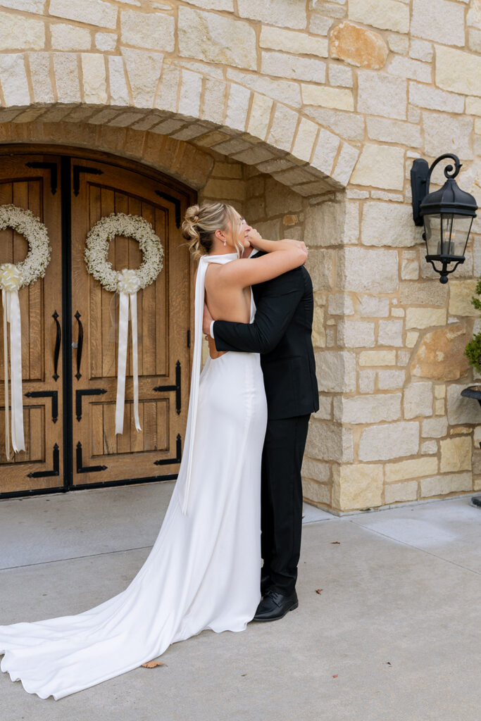 bride and groom hugging after their first look