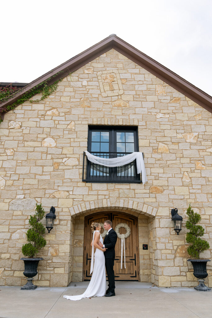 bride and groom kissing at their first look