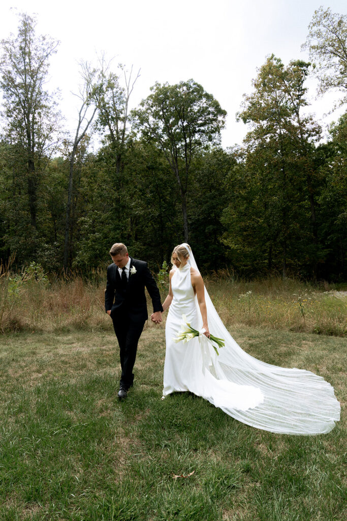 cute couple walking around their wedding venue in St. Louis 