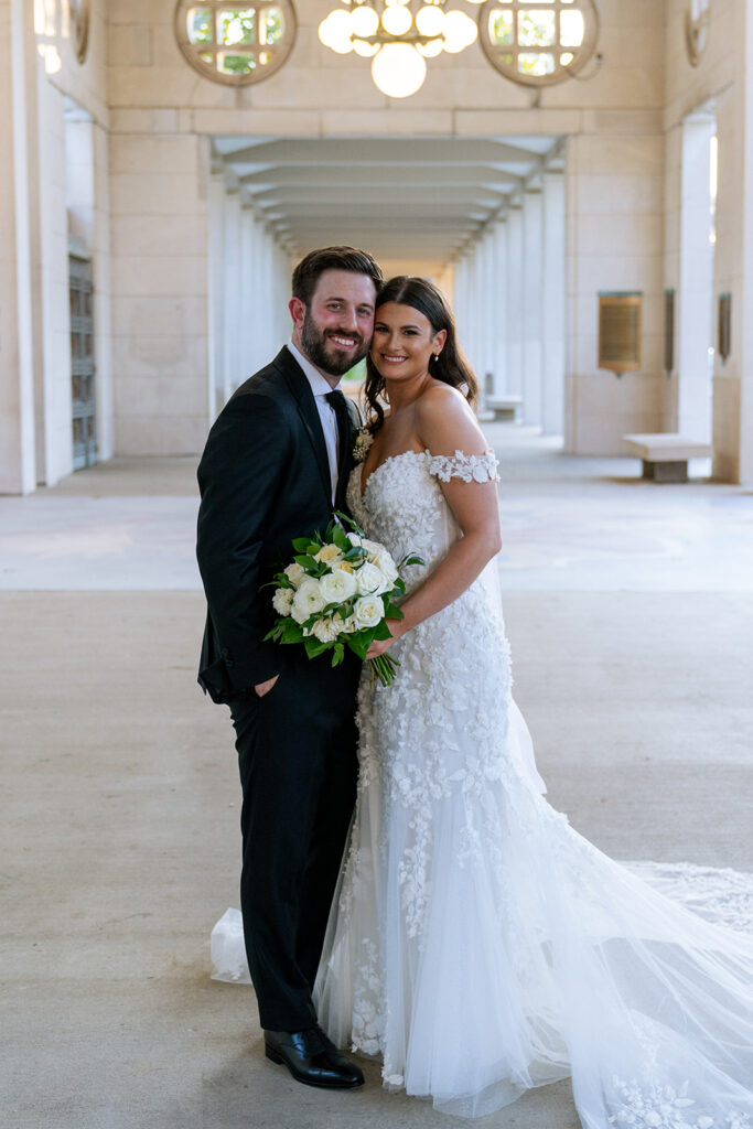 couple posing for the camera during their photoshoot