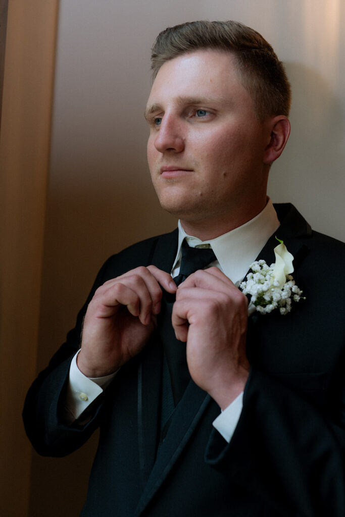 picture of the groom getting ready for his editorial wedding ceremony