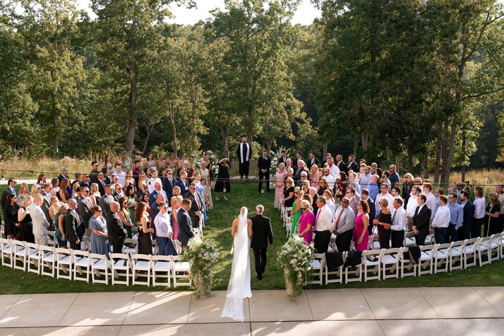 stunning picture of the bride walking down the aisle 