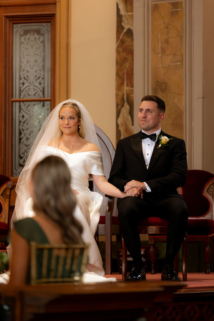 bride and groom holding hands at their wedding ceremony