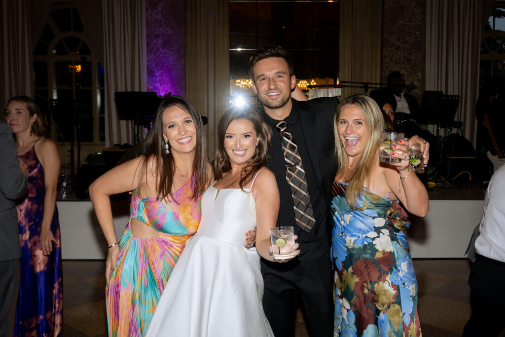 bride dancing with her guests at the reception party