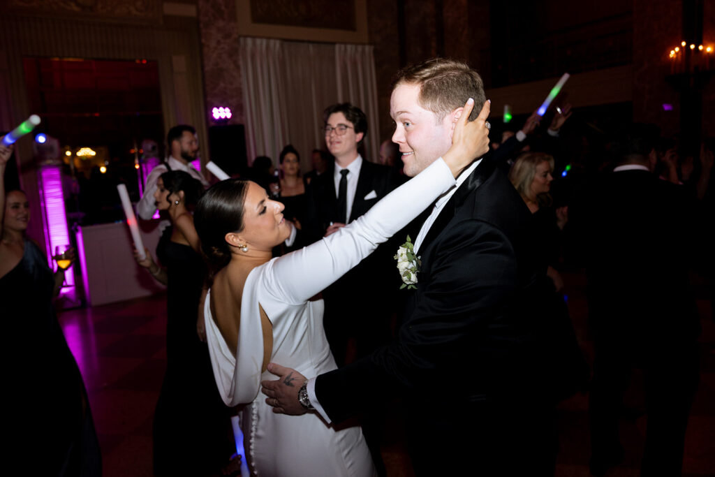 newlyweds dancing at their lively reception party