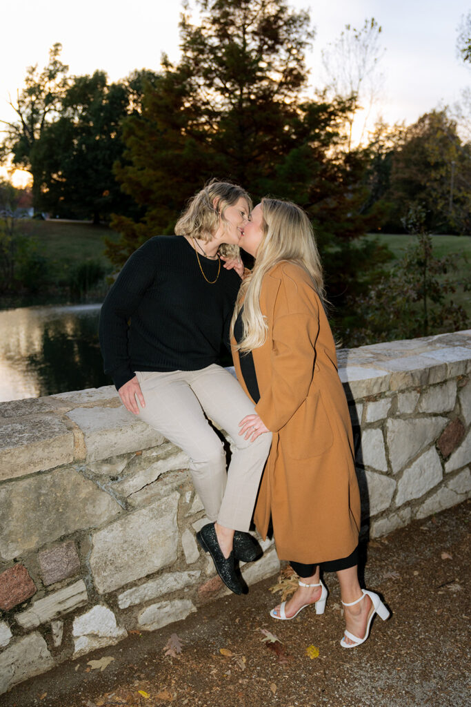 cute couple kissing during their fall photoshoot