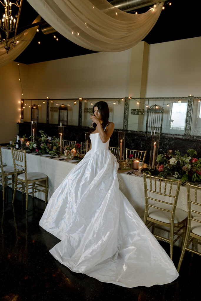 bride enjoying a glass of champagne after her ceremony 