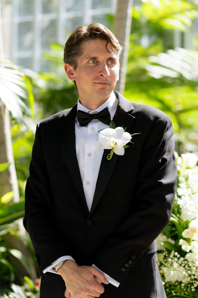 groom emotional watching the bride walk down the aisle 
