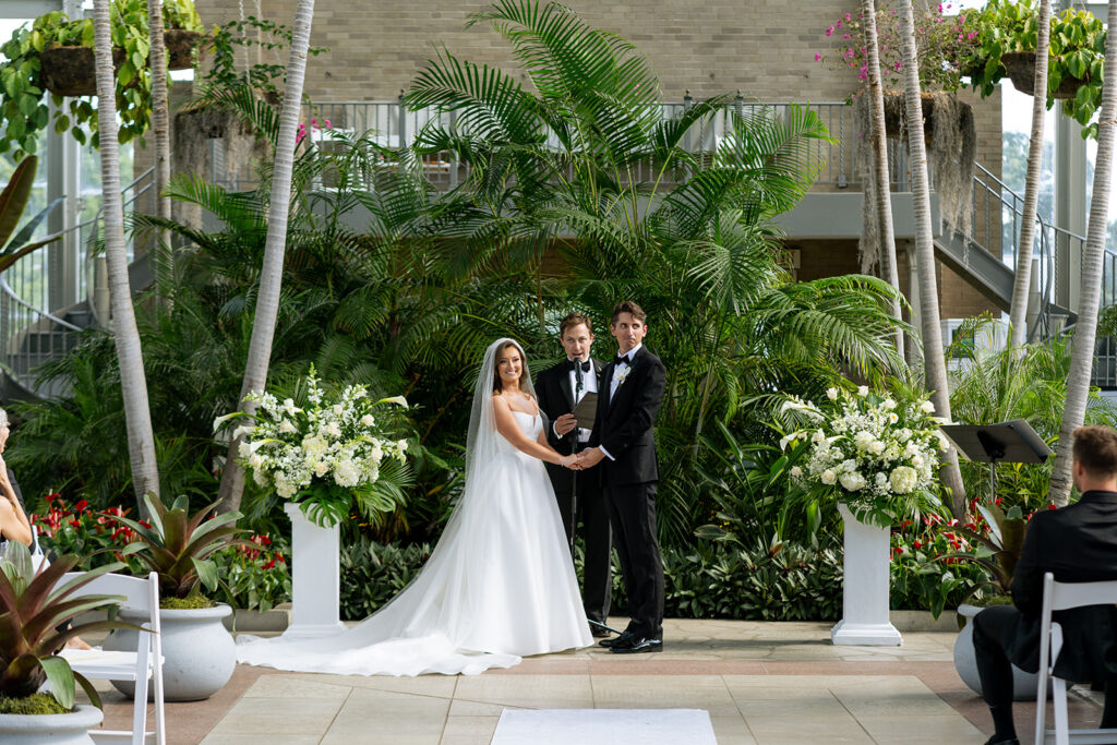 cute couple holding hands at their ceremony 