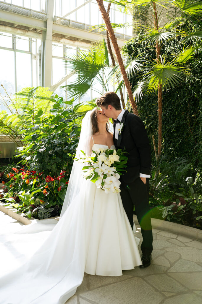 cute picture of the bride and groom kissing