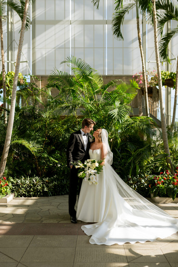 cute portrait of the bride and groom smiling at each other