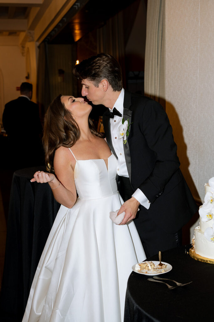newlyweds cutting their wedding cake