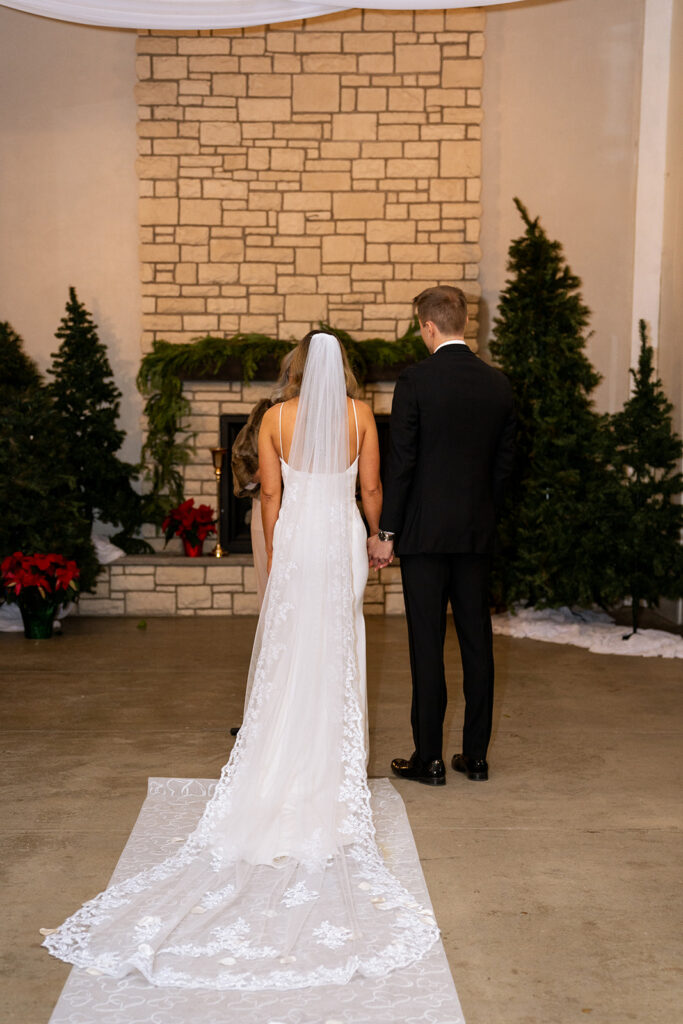 cute couple holding hands at their ceremony