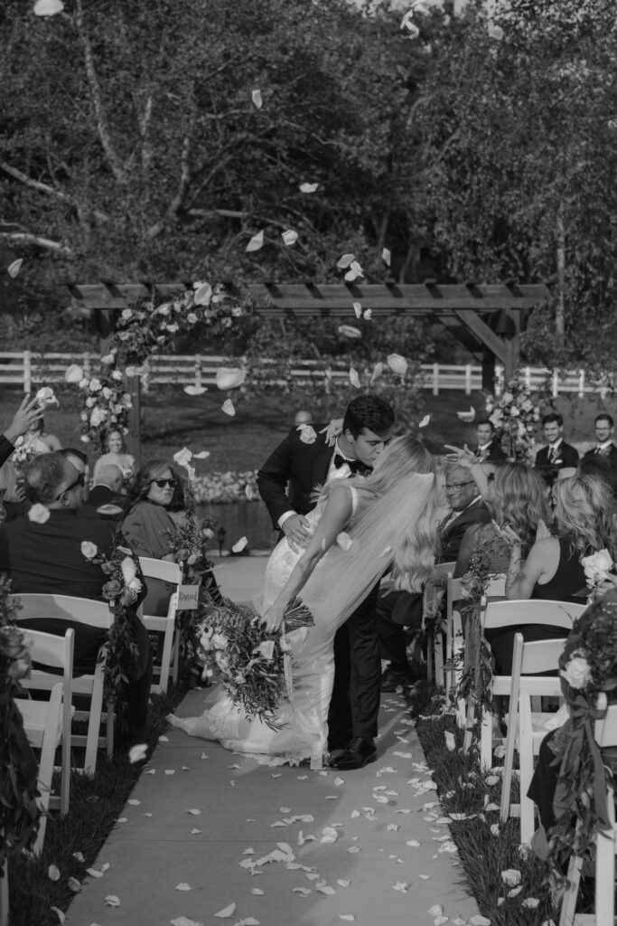 cute couple kissing after their ceremony 