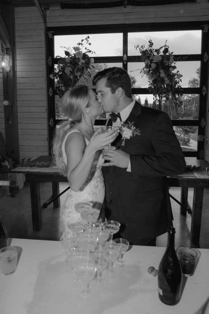 cute picture of the newlyweds celebrating with champagne