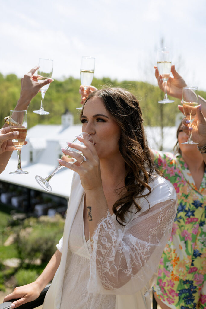bride and her bridesmaids having fun getting ready 