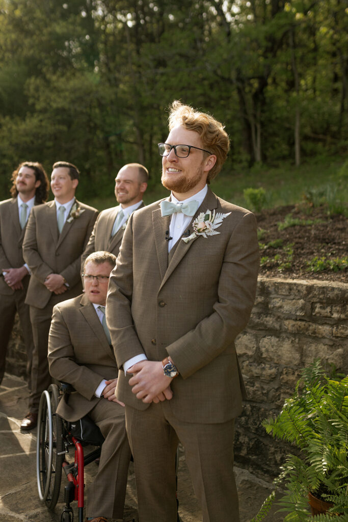 groom emotional watching the bride walk down the aisle