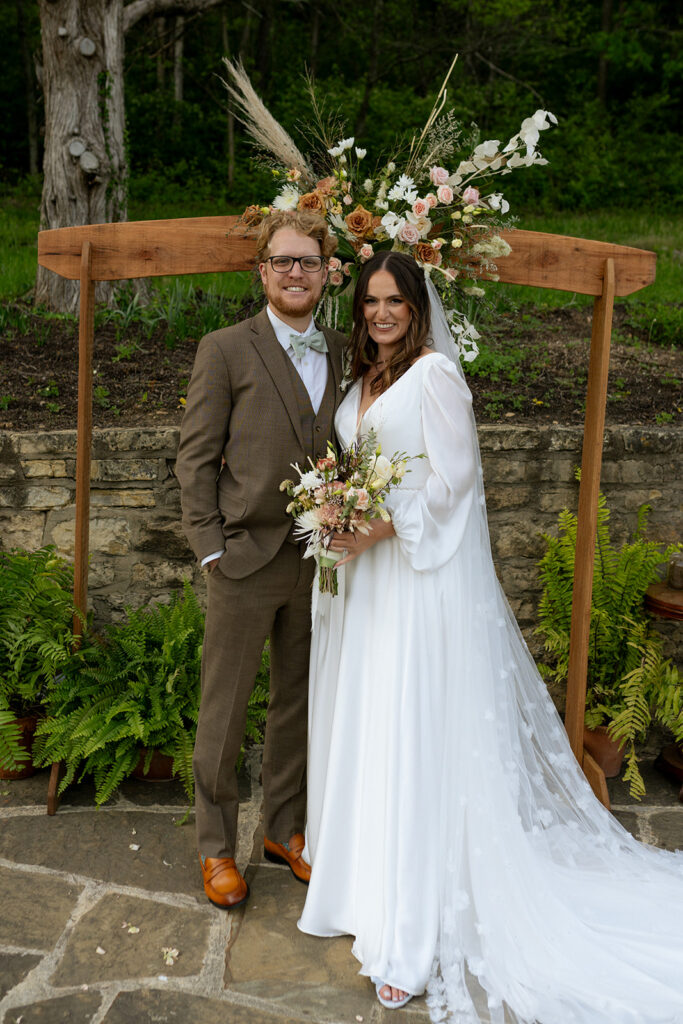 cute picture of the bride and groom posing for the camera during their bridal portraits 
