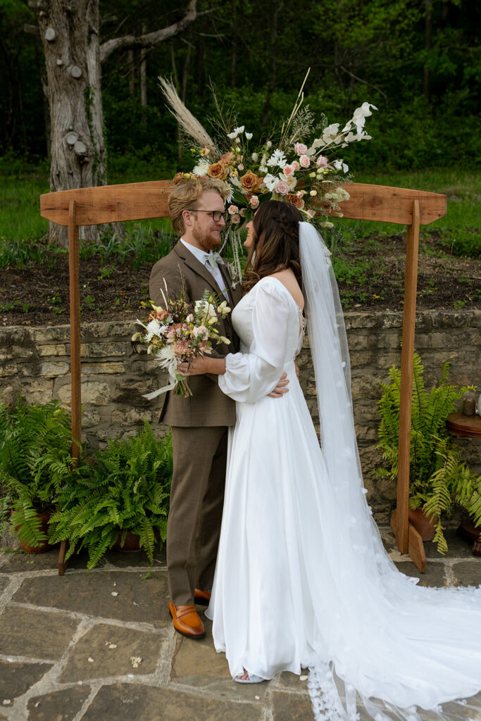 picture of the bride and groom smiling at each other