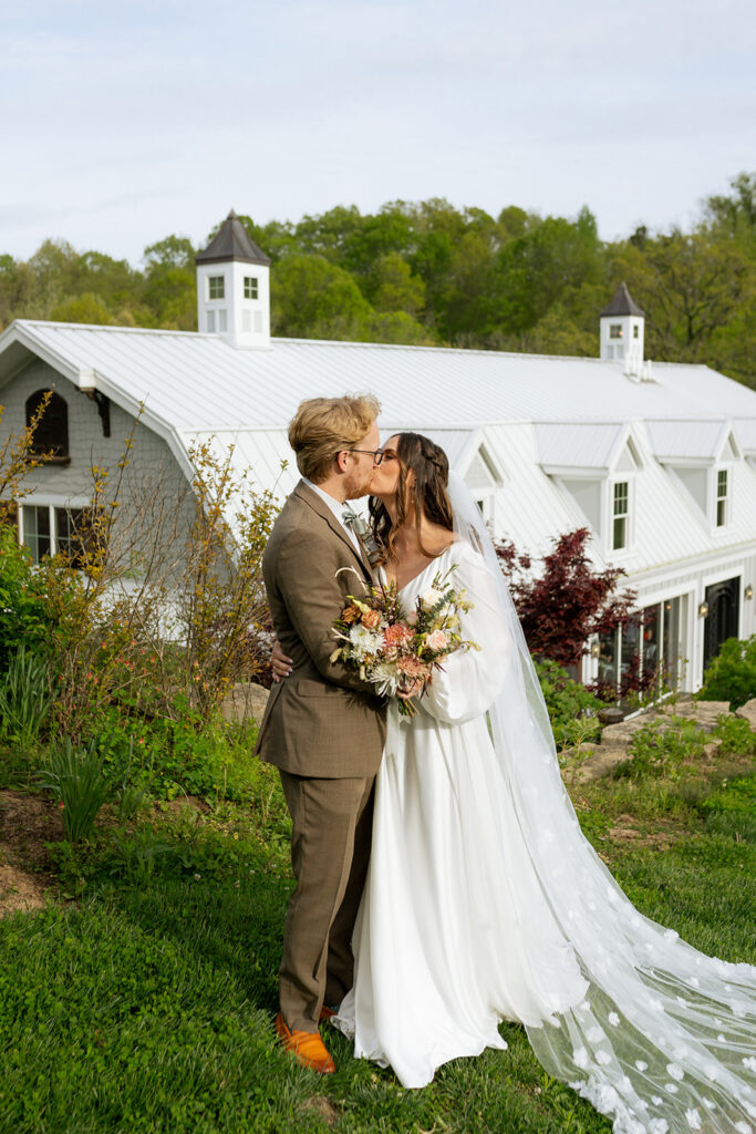 cute picture of the bride and groom kissing during their bridal session
