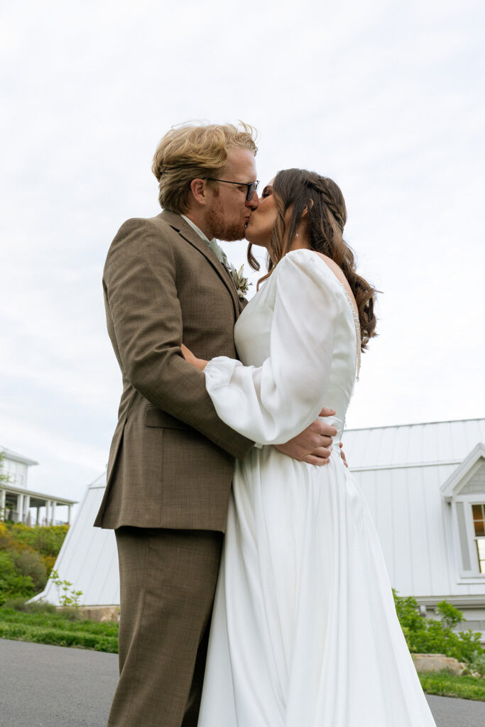 portrait of the bride and groom kissing 