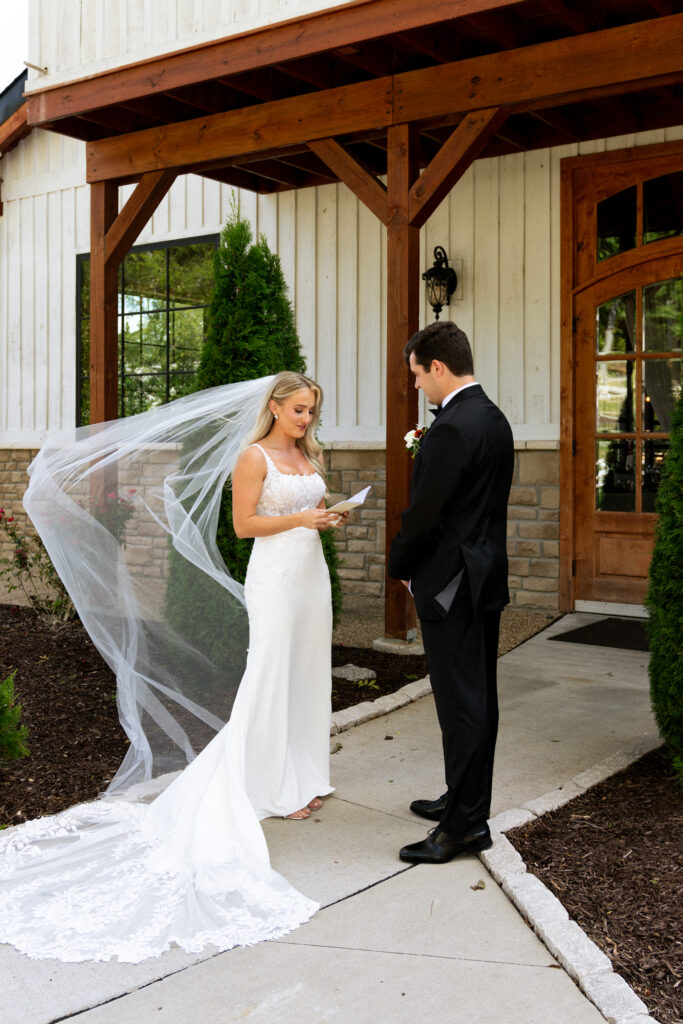 cute couple reading their vows before the ceremony