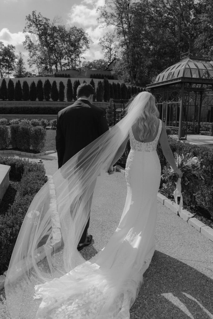 cute couple walking around their dream wedding venue