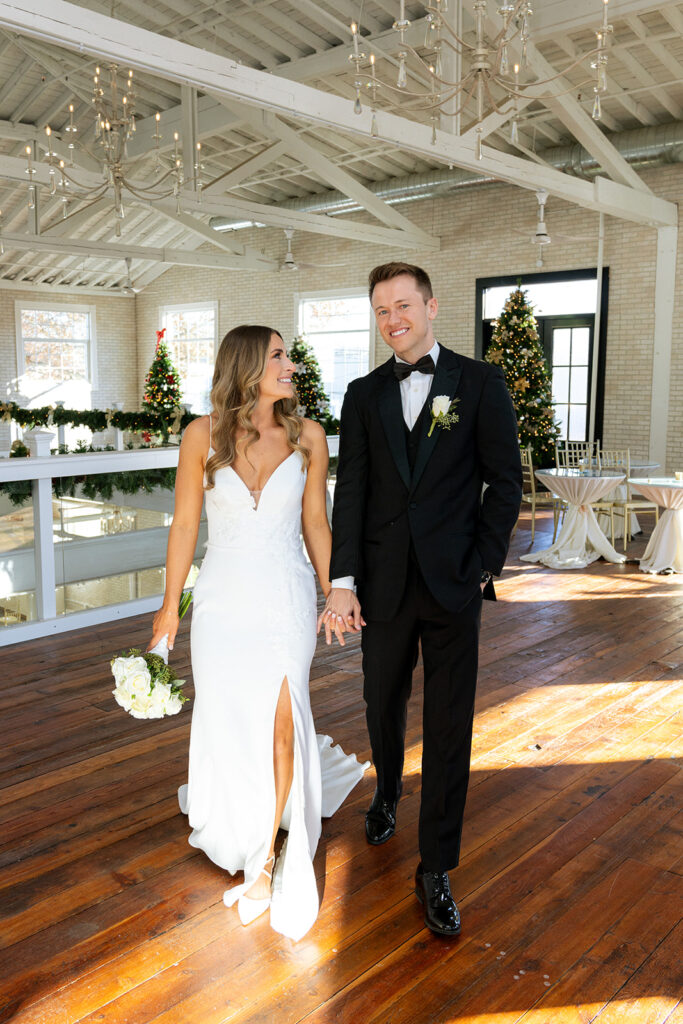 couple walking around their dream wedding venue during their bridal portraits