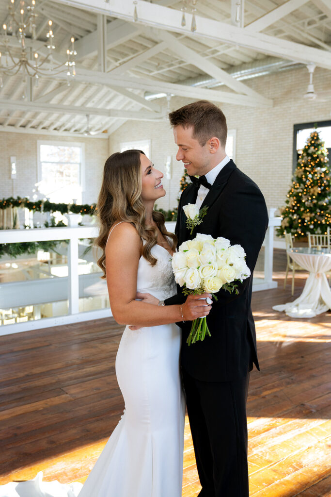 portrait of the newlyweds laughing with each other during their photohsoot