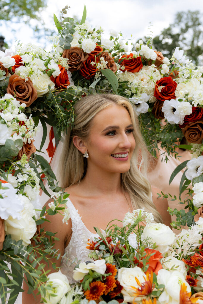 cute picture of the bride with her wedding bouquet 