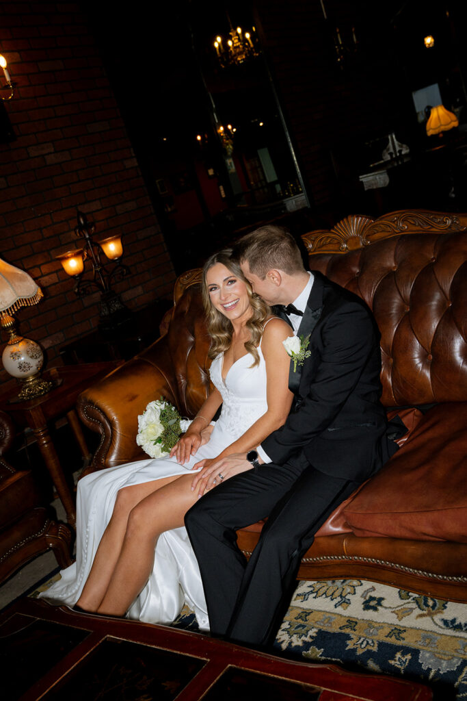 picture of the groom kissing the bride on the cheek