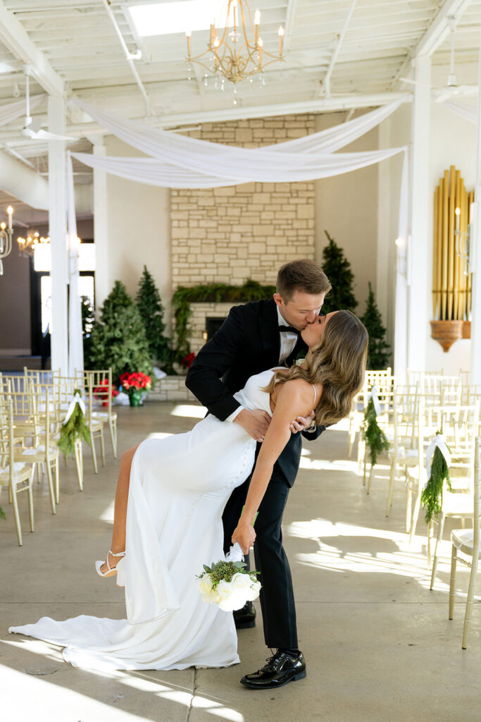 picture of the newly married couple kissing 