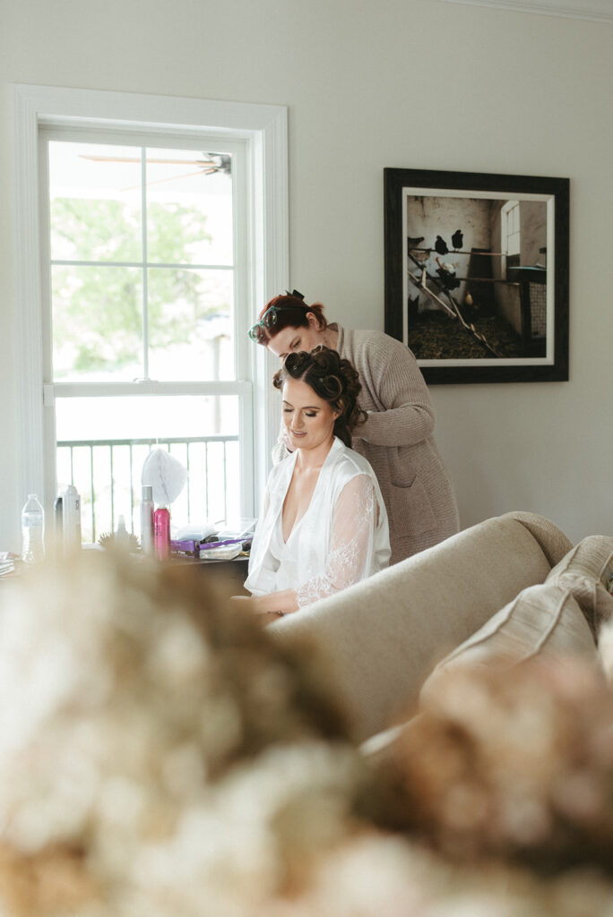 bride getting her hair done for her dream ceremony