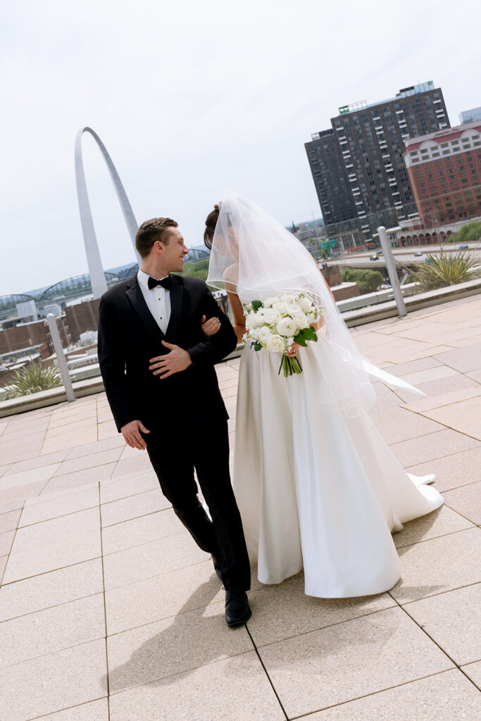 cute picture of the bride and groom smiling at each other 
