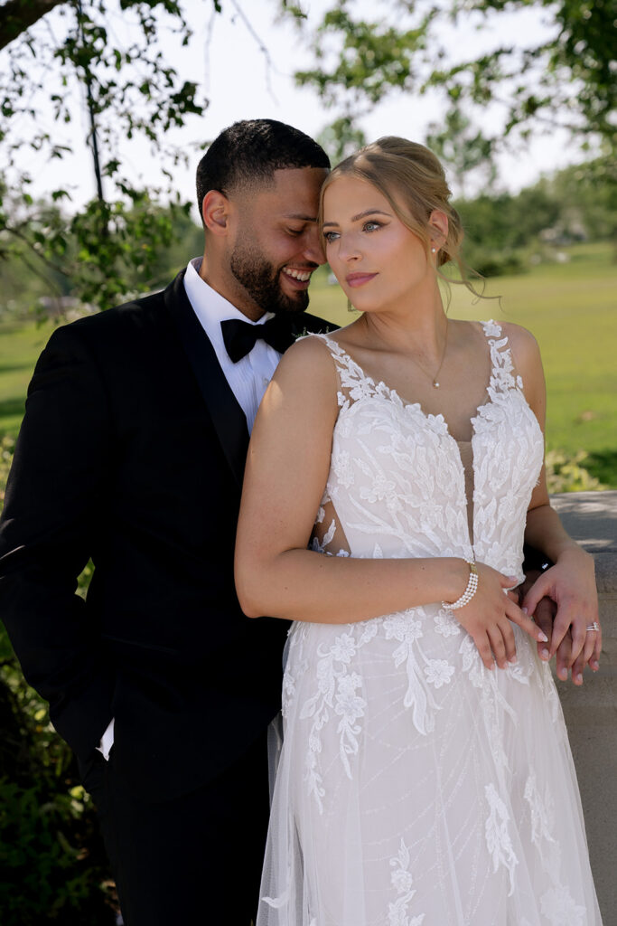groom kissing the bride on the cheek