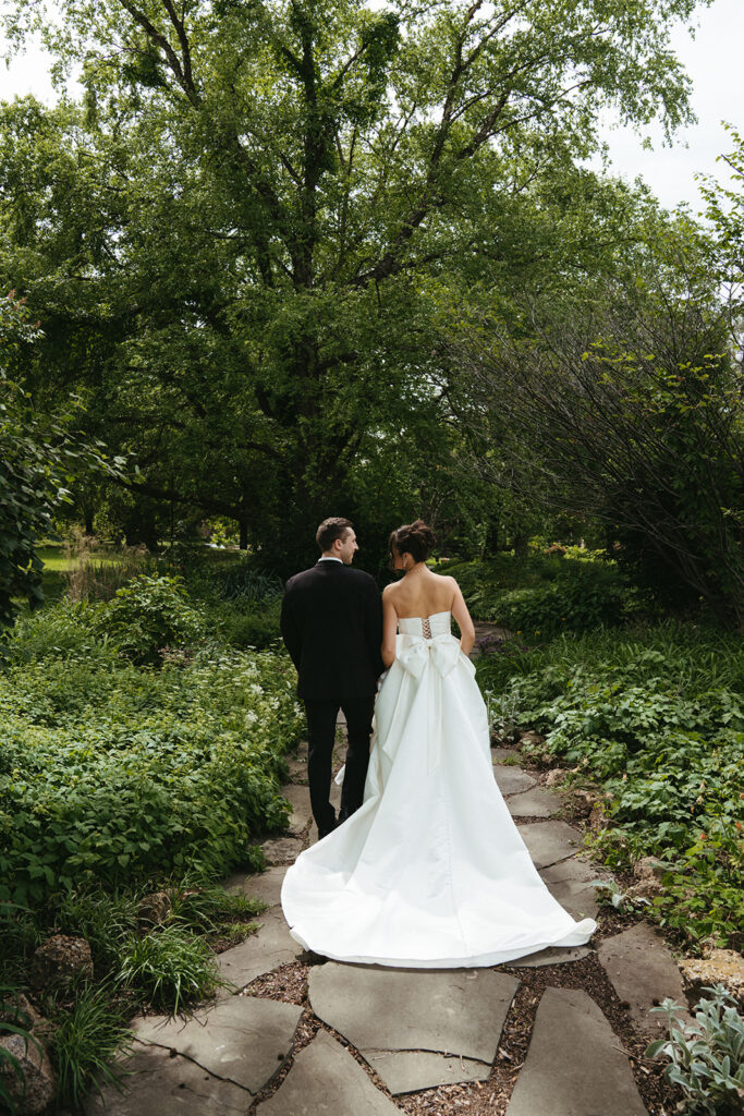 cute couple wallking around their wedding venue during their bridal portraits 