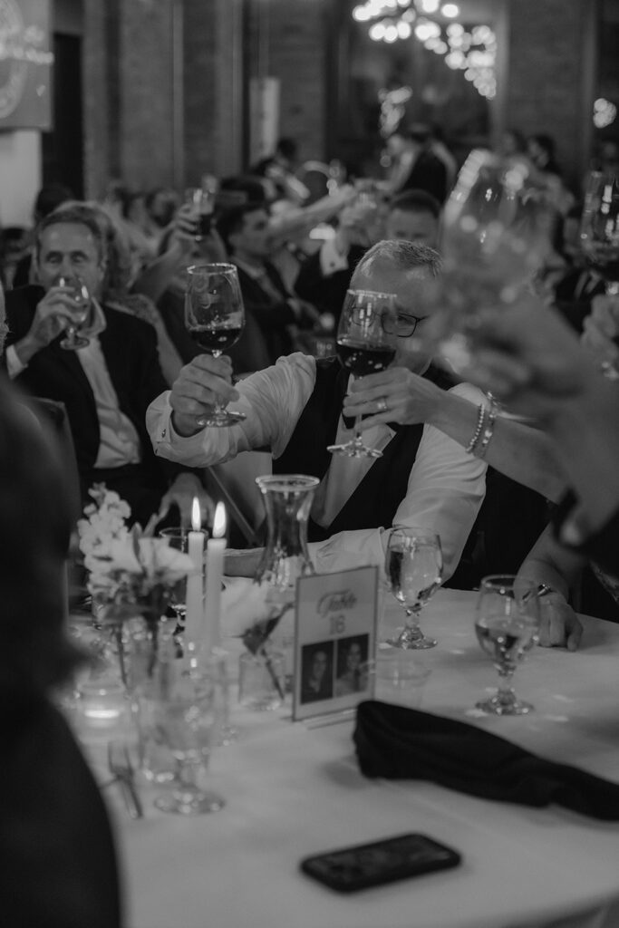 wedding guests celebrating the newlyweds with champagne 